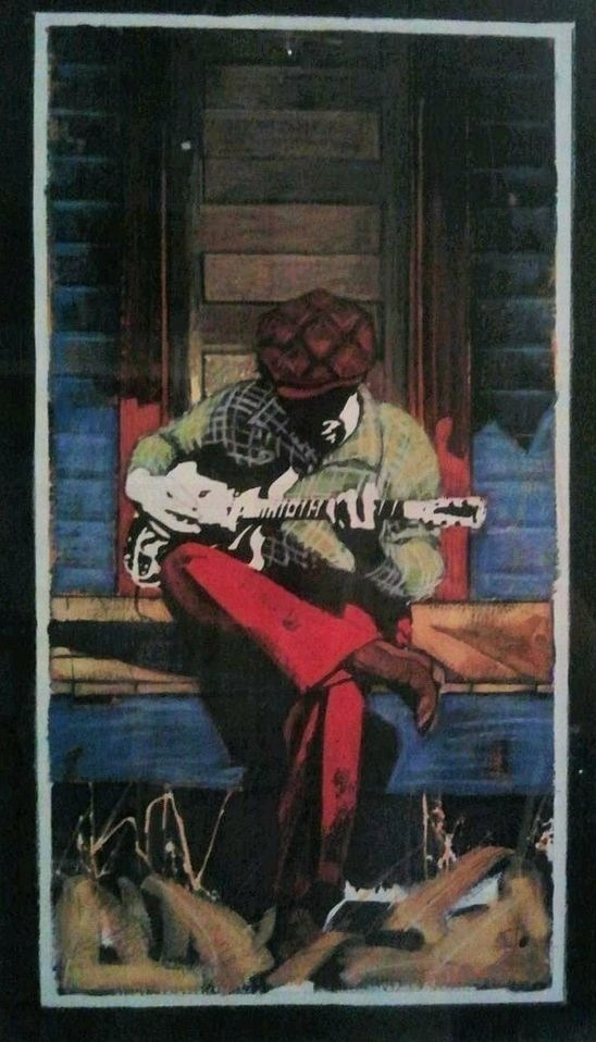 Hombre tocando la guitarra imagen ilustrativa.